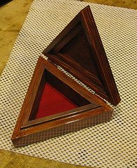 triangle shaped wood box with red mahogany finish