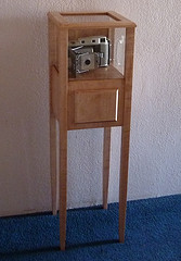 tall and thin display cabinet 
in maple with drawer