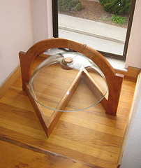 arch suspension of an inverted glass sink bowl.