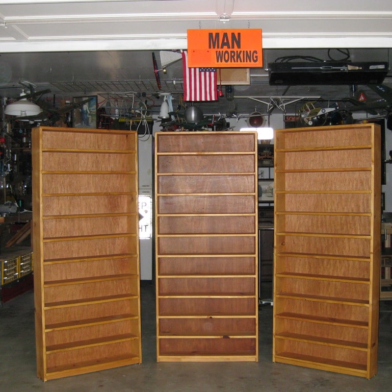 These two cases flanking the original were built to display a sizeable salt and pepper shaker collection